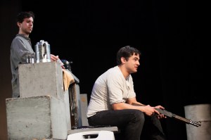 Boomer (Rocket Thrall) talks his shitkicker dreams while Dirt (Kevin Hippler) cleans the house. Photo by Lawrence Peart, courtesy of the University of Texas at Austin